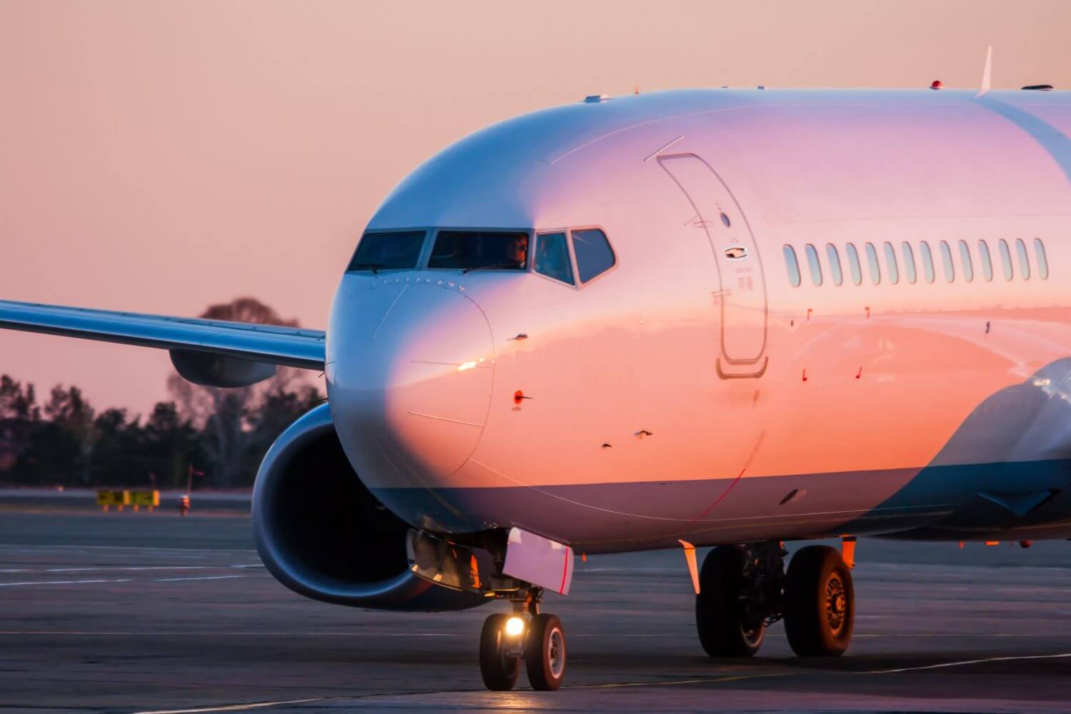 Taxiing aircraft in the morning crimson