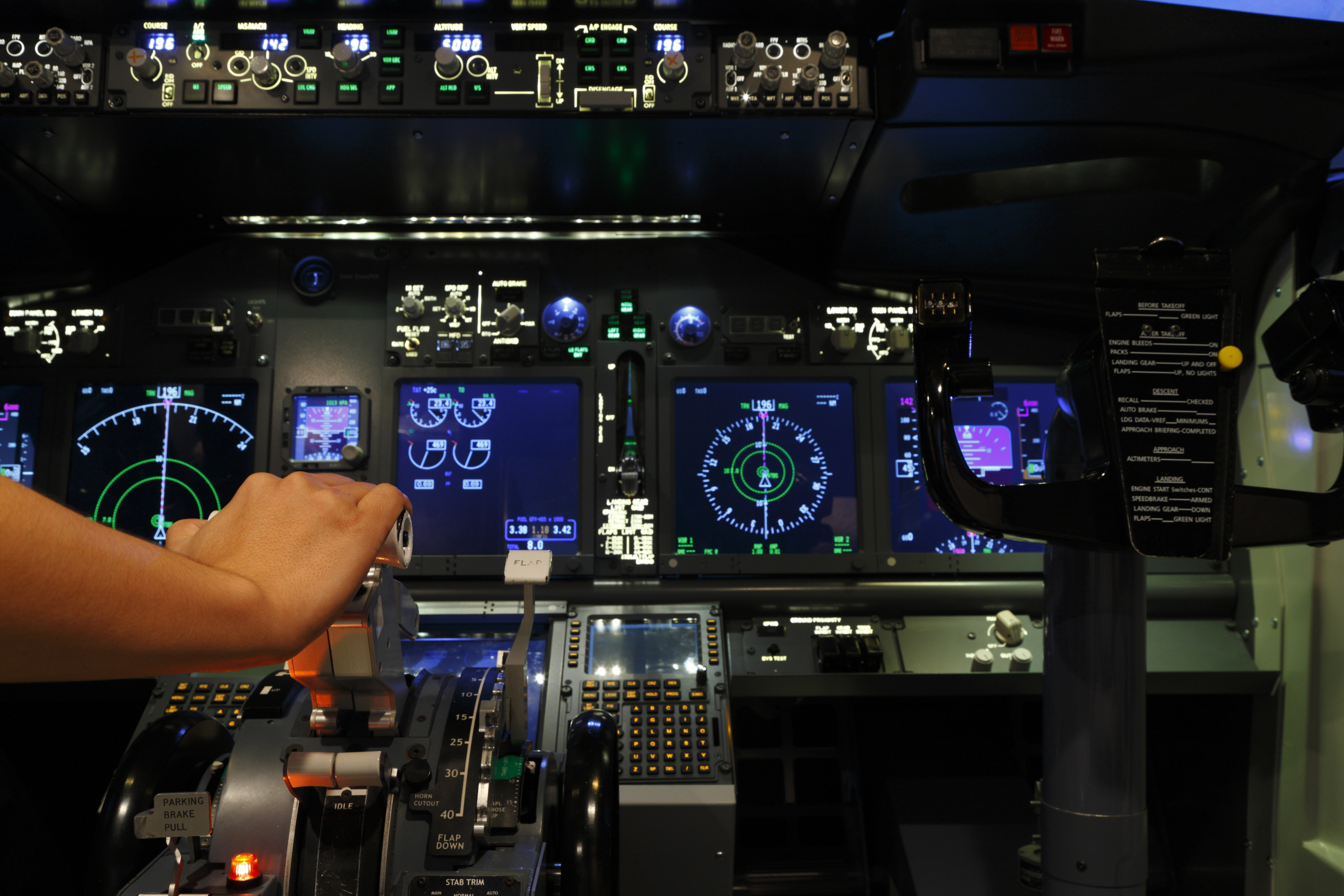 Boeing 737NG cockpit illuminated at night for pilot training and simulator revision