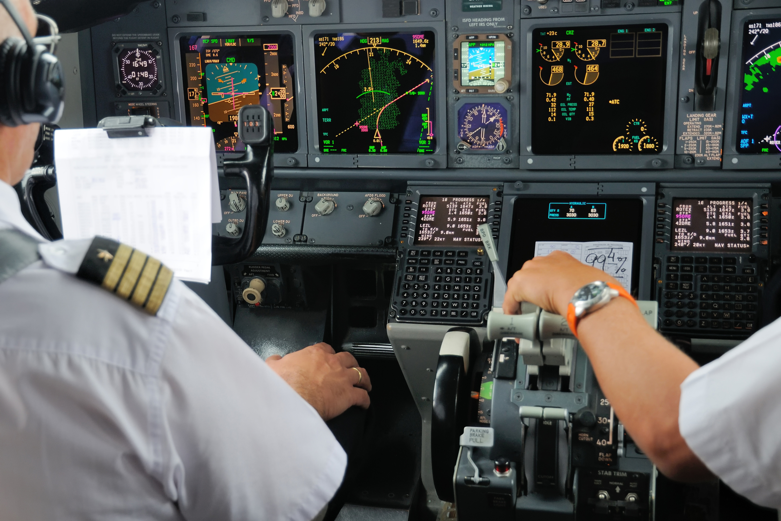 Boeing 737NG cockpit in use with pilots operating the flight deck